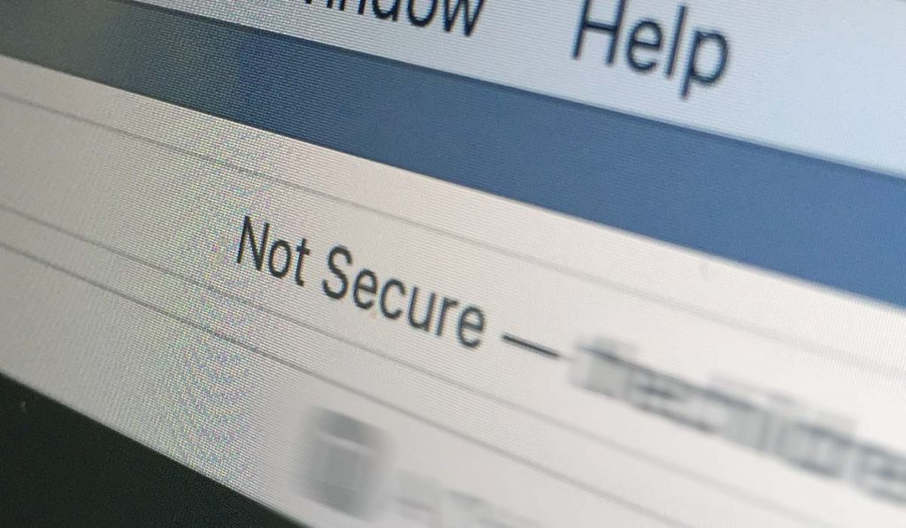 Closeup of computer screen with text "Not Secure" in browser address bar