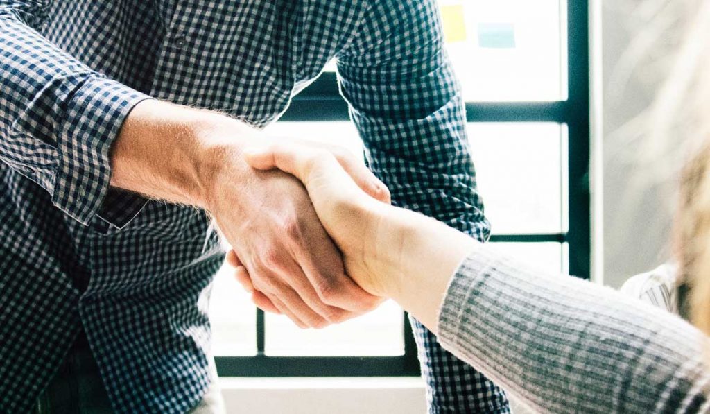 Man and woman shaking hands