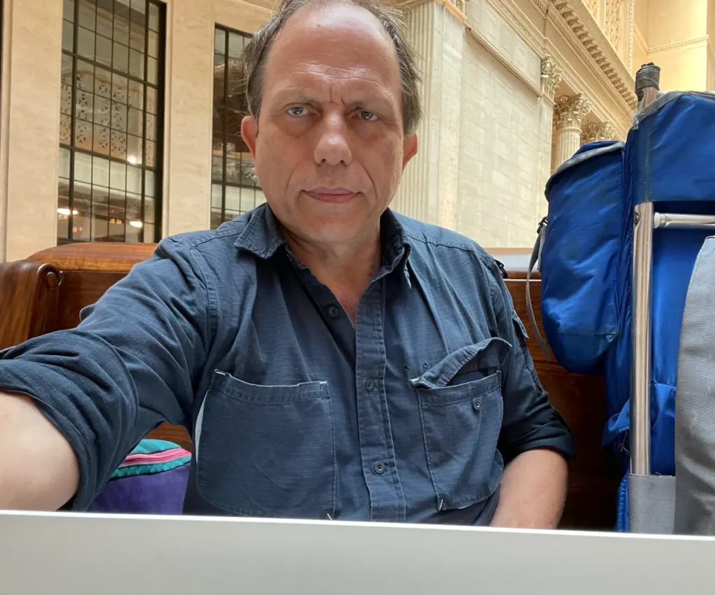 Claes Jonasson with computer at Union Station, Chicago