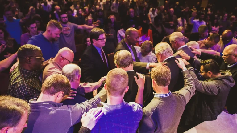 large group of people in prayer
